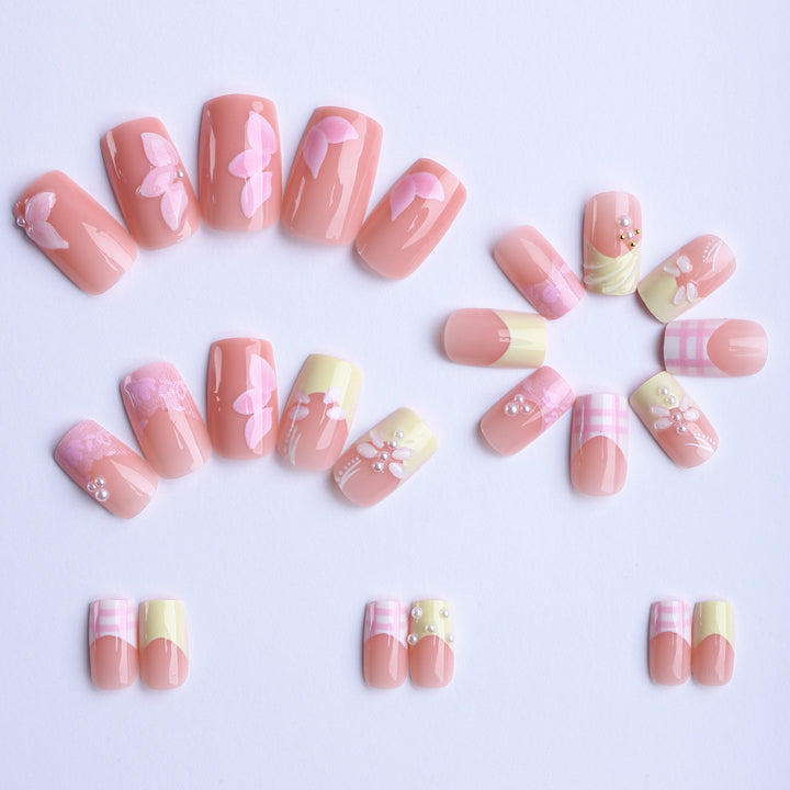 Artificial nails with creative floral designs and glitter accents Bowlift