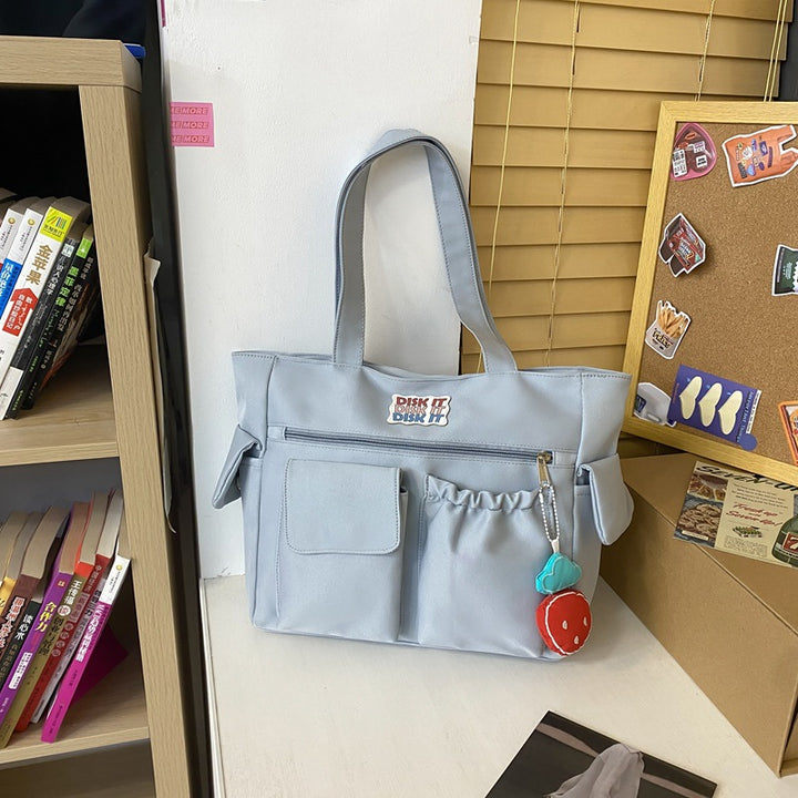 Tote bag with versatile compartments and ergonomic design Bowlift