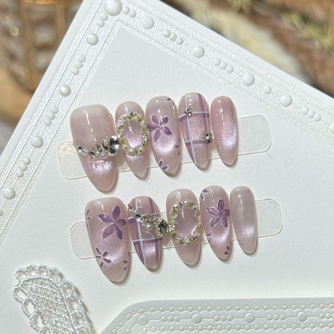 Artistic Press-On Nail Set with Floral Accents Bowlift
