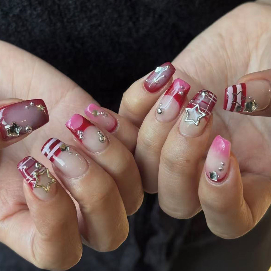 Artificial fingernails with handcrafted star decorations Bowlift