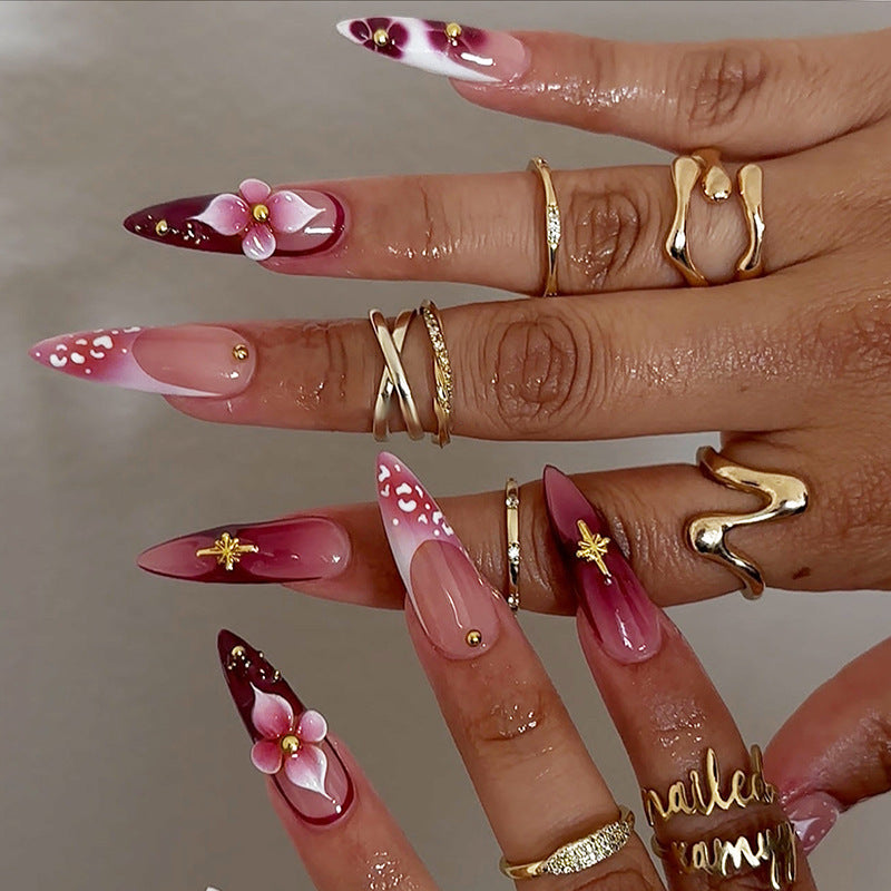 Artifical nail set with delicate floral design and glamorous accents Bowlift