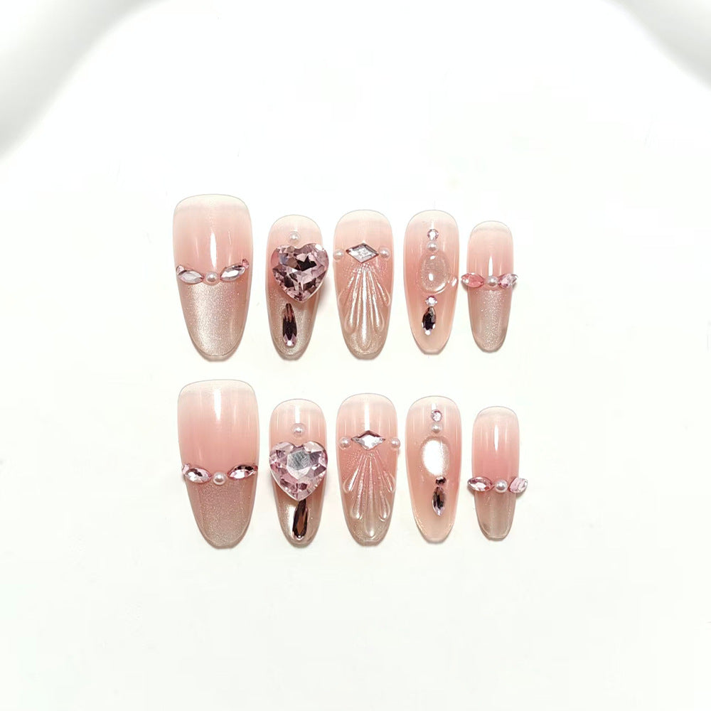 Artificial nails with sparkling heart and rhinestone accents Bowlift