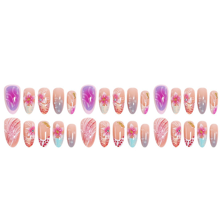 Artificial nail set with floral designs and glamorous accents Bowlift