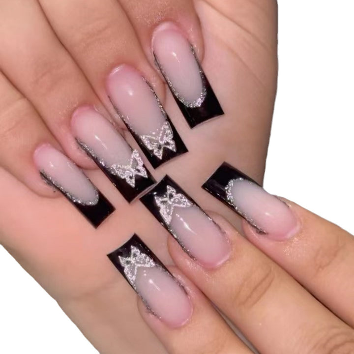 Glamorous Stiletto Nail Extensions with Butterfly Accents Bowlift
