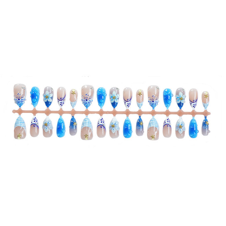 Artificial nail set with maritime motifs and floral design Bowlift