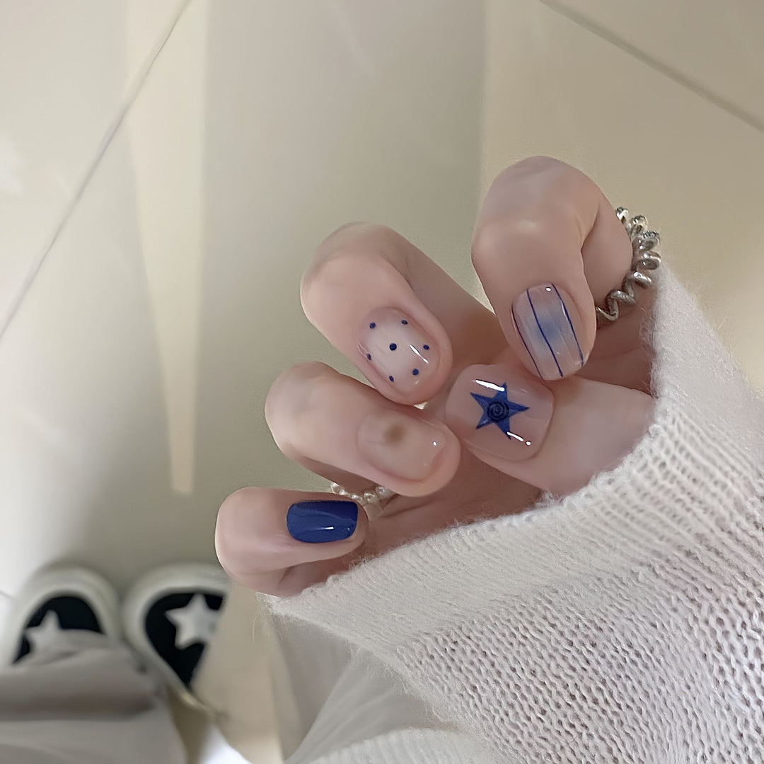 Artificial nails in modern design with geometric and sparkling accents Bowlift