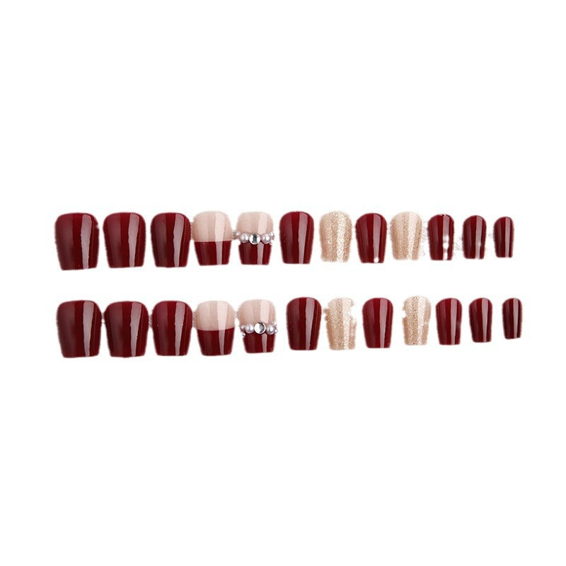 Glamorous artificial nails with glitter and pearl decorations Bowlift