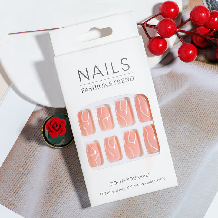 Elegant Press-On Nail Design with Artistic White Swirl Bowlift