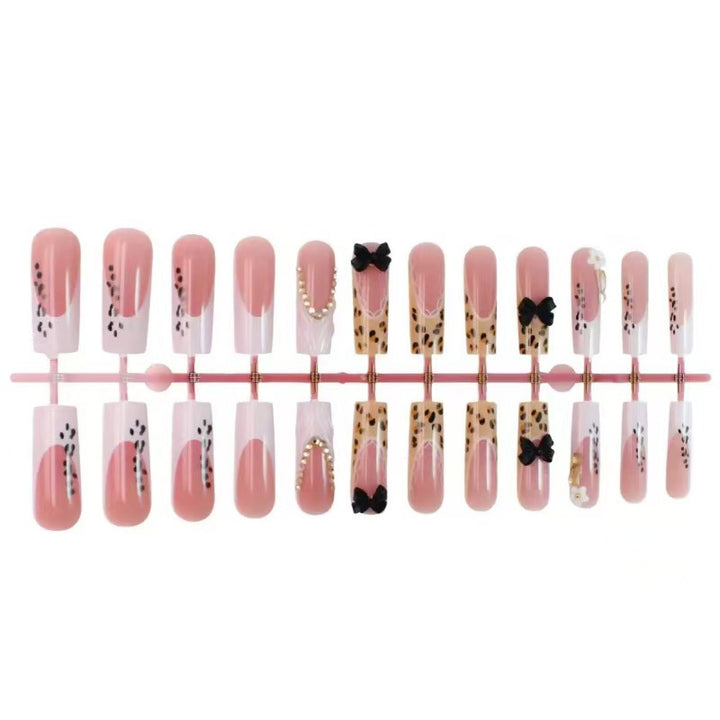 Artistic Press-On Nail Design with Bow and Animal Print Accents Bowlift