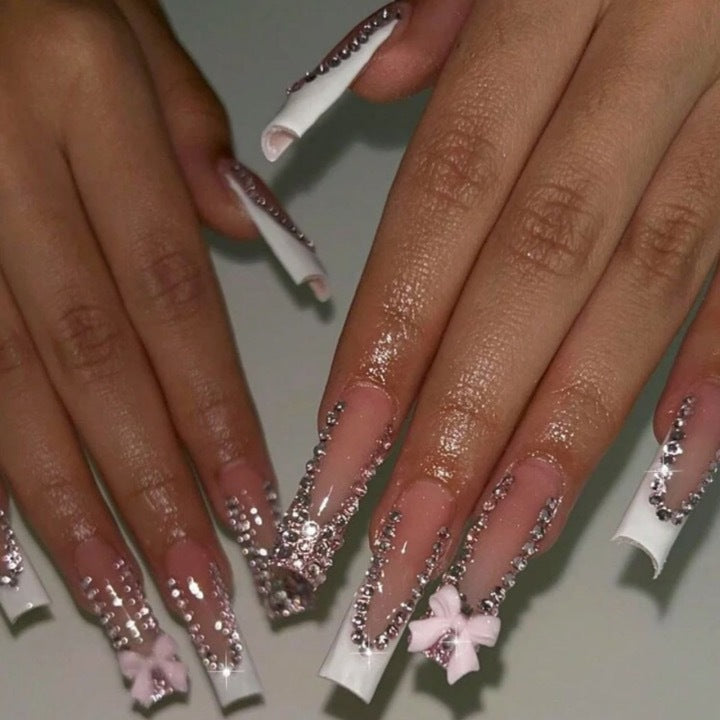 Artificial nails with glamorous rhinestone decorations and floral accents Bowlift