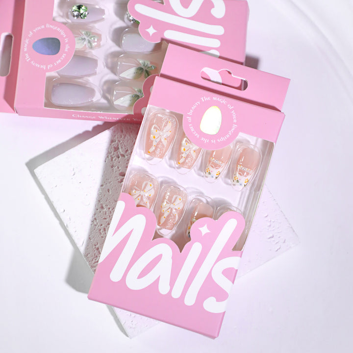 Artful Nail Extensions with Floral Design and Bow Accents Bowlift