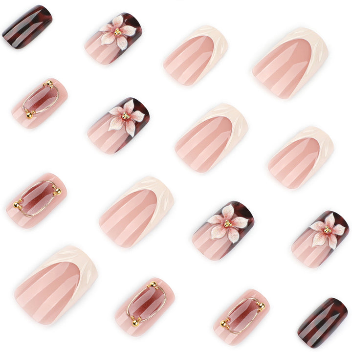 Artistic stiletto nails with elegant floral design and glitter effects Bowlift
