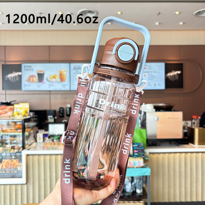Women's large transparent drinking bottle with integrated carrying handle Bowlift
