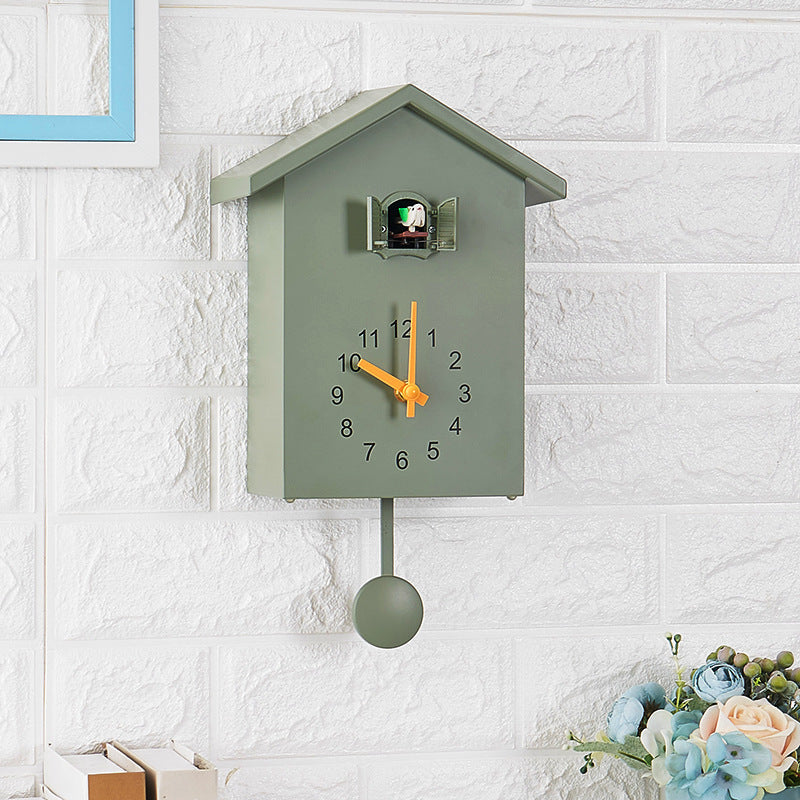 Cuckoo clock in creative house design Bowlift
