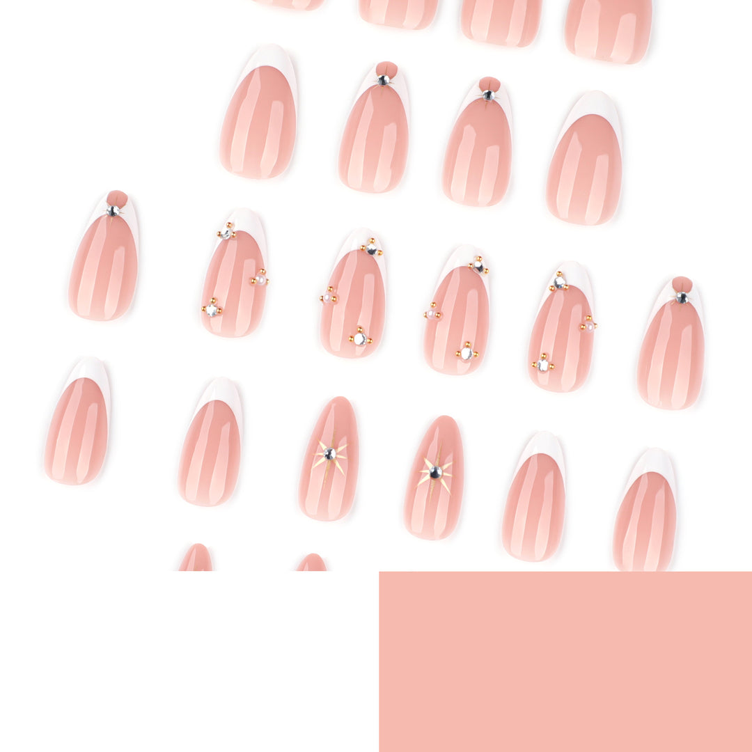 Glamorous nail art with rhinestones and gold accents Bowlift