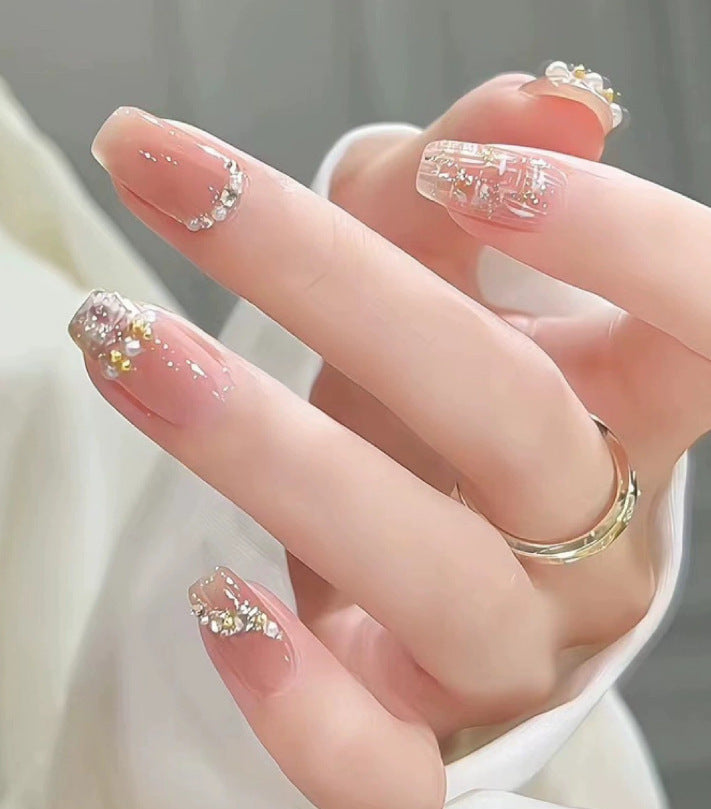 Elegant nail design with pearl embellishment Bowlift