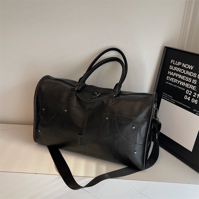 Elegant leather bag with stylish design and versatile carrying options Bowlift