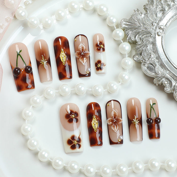 Elegant nail art set with floral and golden accents Bowlift