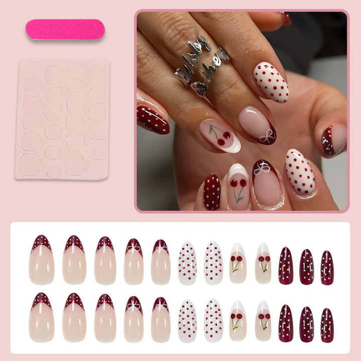 Artificial nail set with elegant cherry and polka dot patterns Bowlift