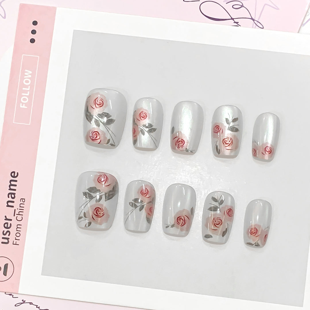 Artful nail extensions with rose designs Bowlift