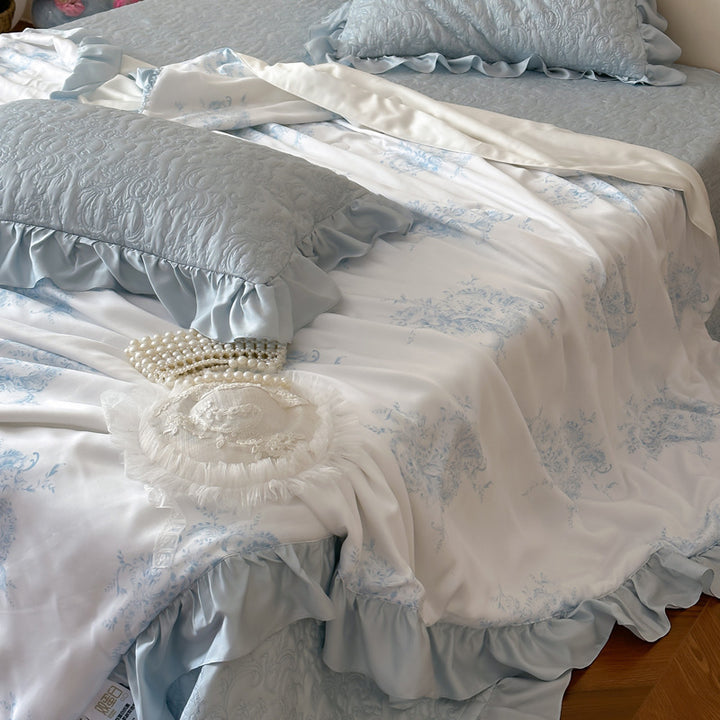 Quilted bedspread with ruffle and reversible satin bedding set
