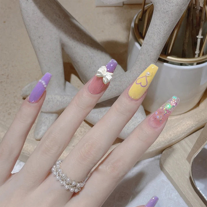 Artful Gel Nails with Elegant Floral Design and Glitter Accents Bowlift