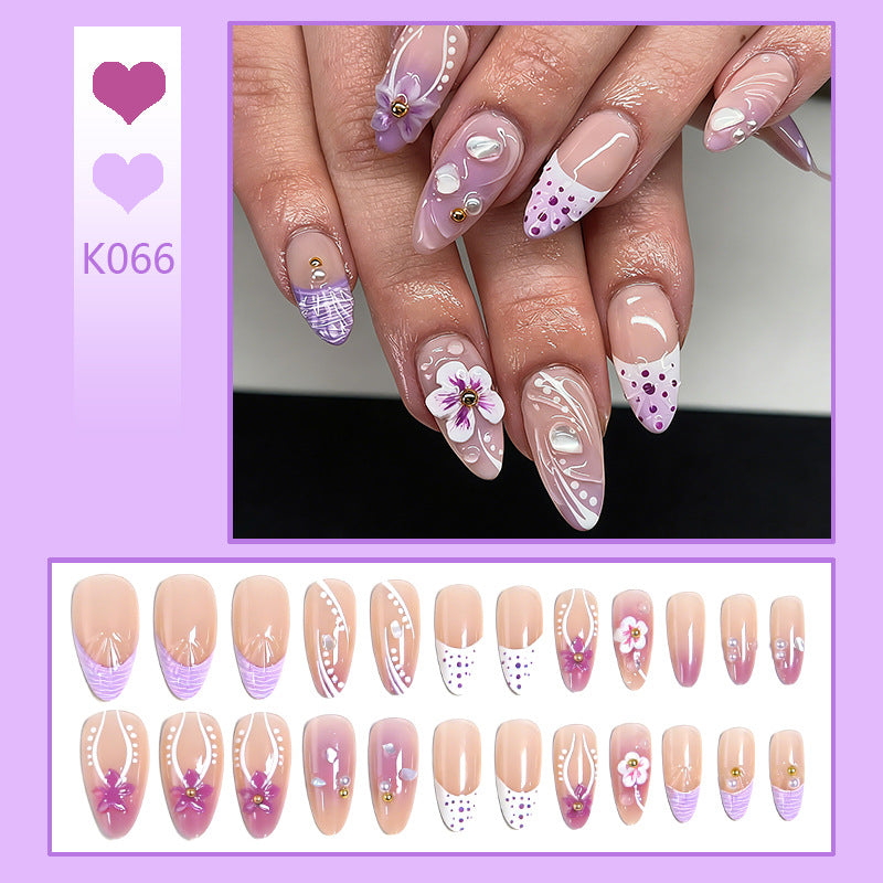 Artificial nail set with exotic floral and glitter accents Bowlift