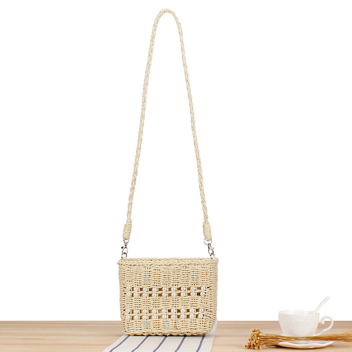 Handbag made of hand-woven natural material with pearl decoration Bowlift