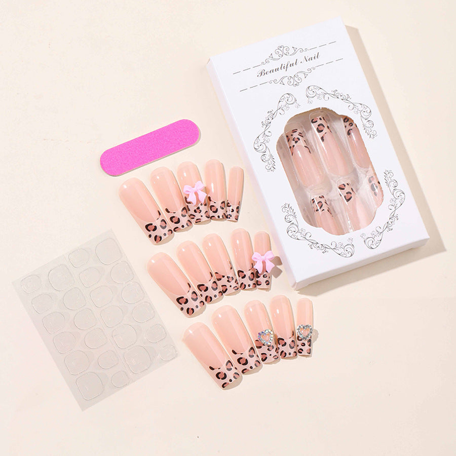 Creative nail set with leopard pattern and bow accents Bowlift