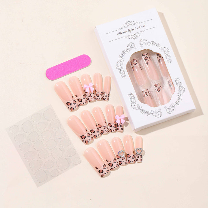 Creative nail set with leopard pattern and bow accents Bowlift