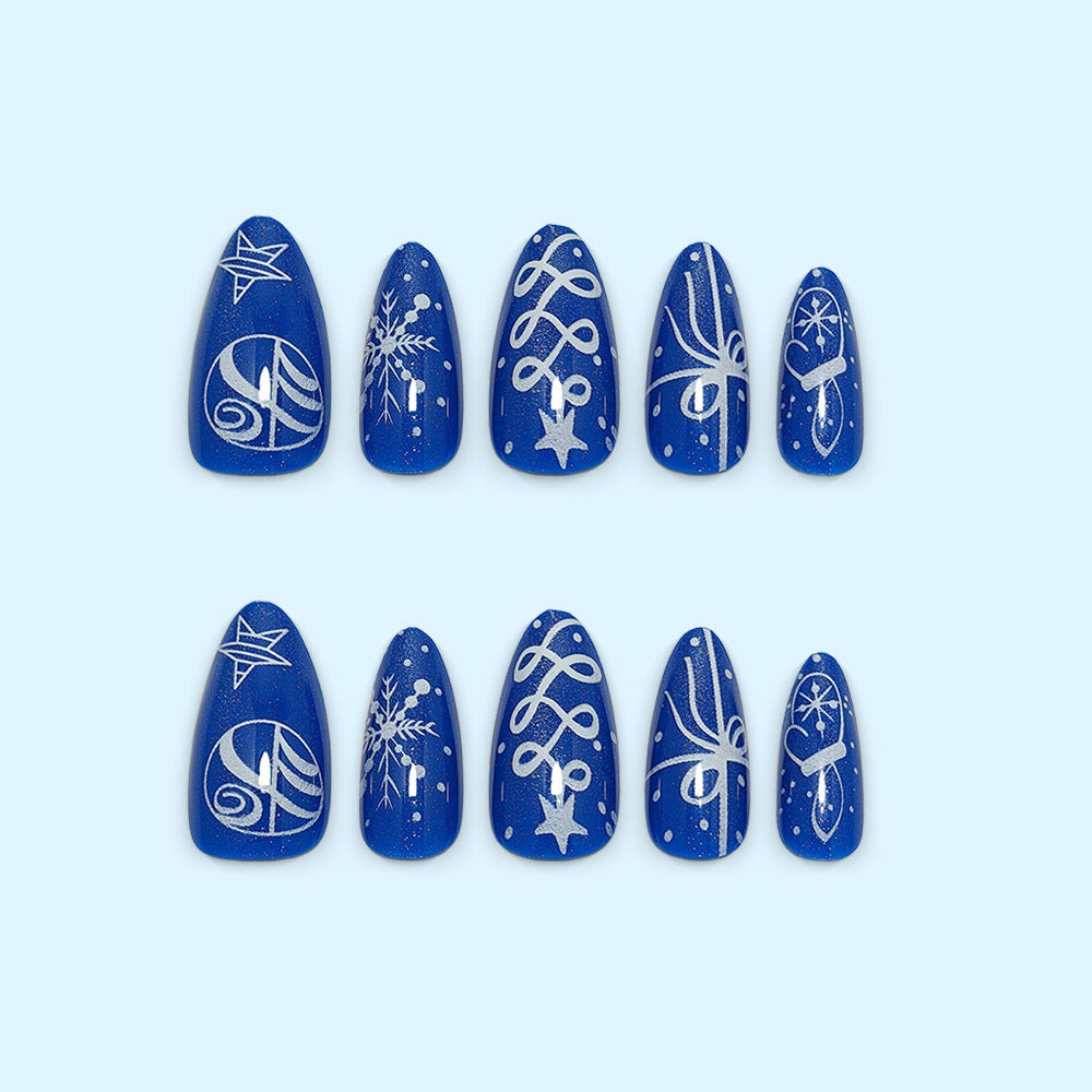 Artificial nails in festive winter design with glittering snowflakes and elegant decorations Bowlift
