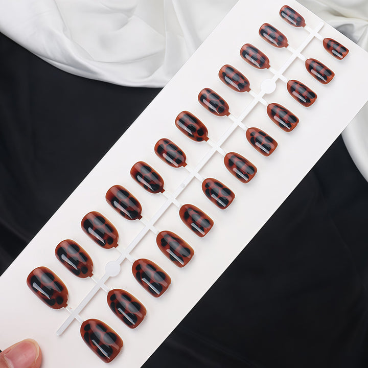 Glossy Stiletto Nail Tips with Leopard Print Design Bowlift