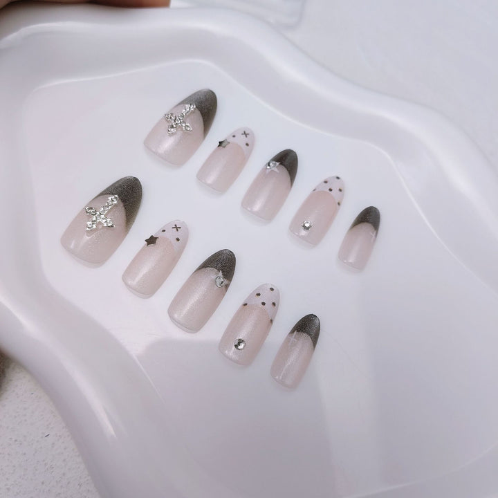 Glittering artificial nail design with elegant accents Bowlift