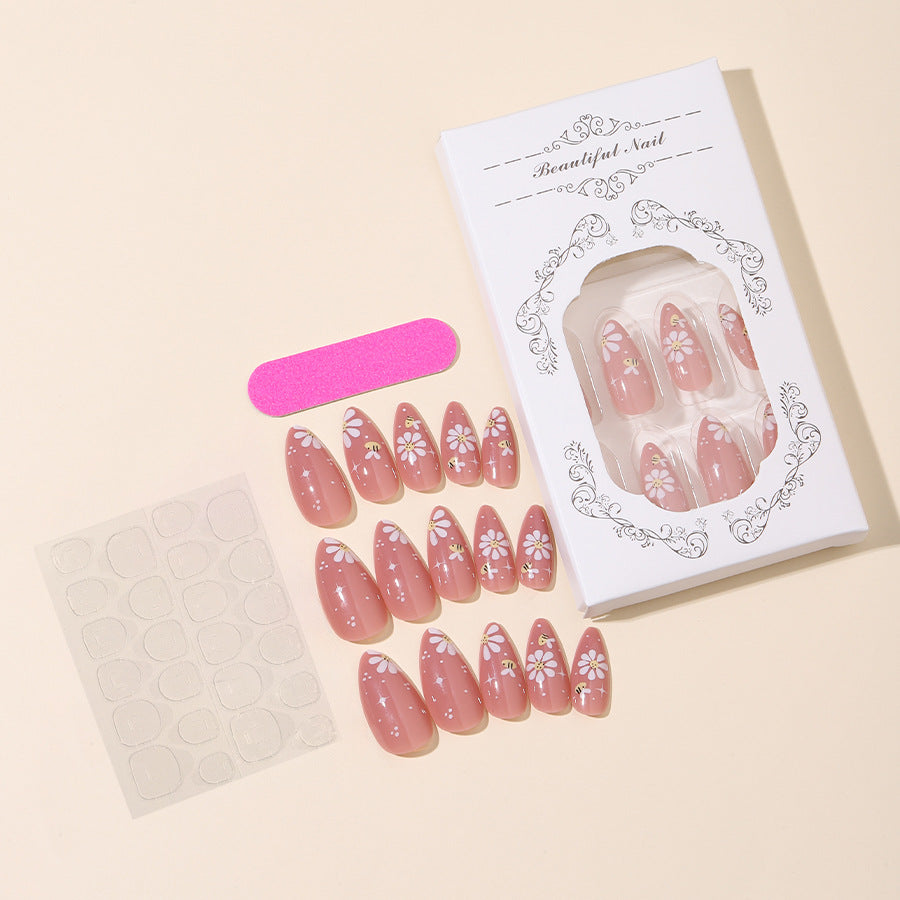 Artificial nails set with elegant flowers and glitter accents Bowlift