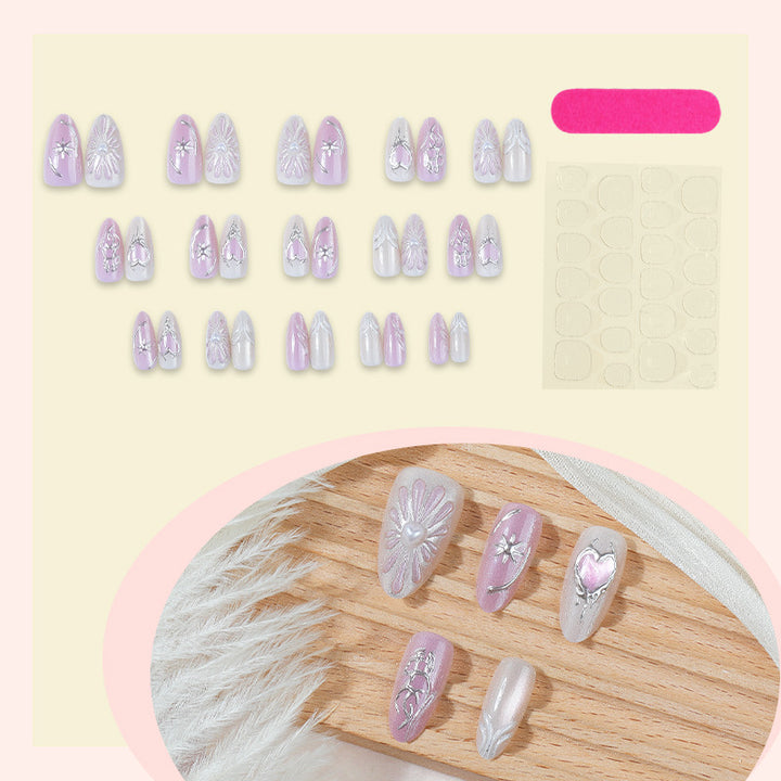 Acrylic nail set with floral accents and glitter embellishments Bowlift