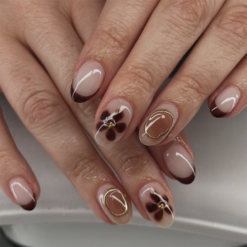 Elegant Nail Art with Floral Accents and Golden Details Bowlift