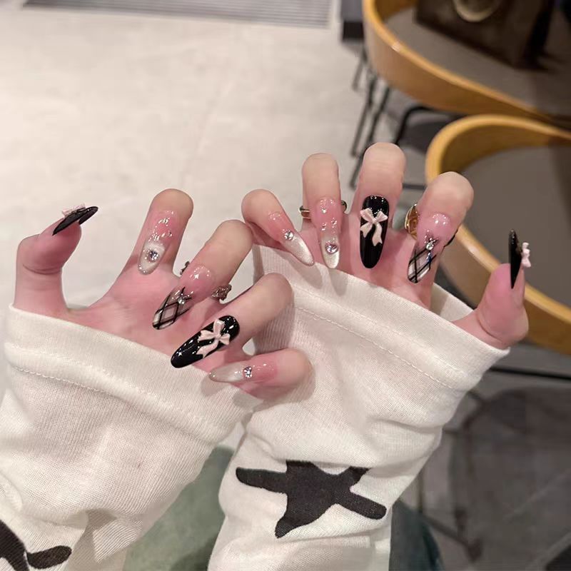 Decorative Press-On Nail Extensions with Bow and Rhinestone Accents Bowlift