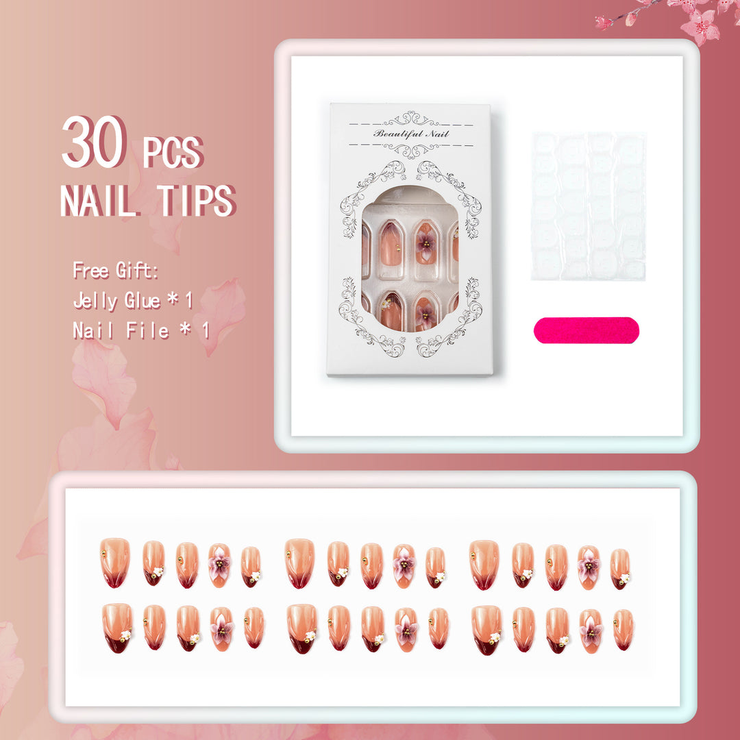 Artificial nail set with floral accents and gold embellishments Bowlift