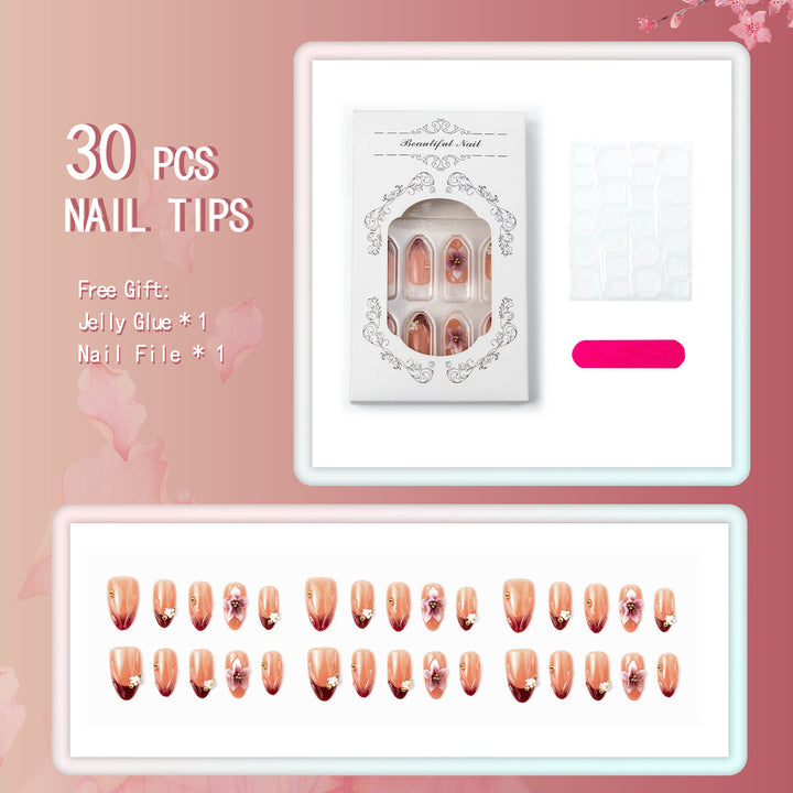 Artificial nail set with floral accents and gold embellishments Bowlift