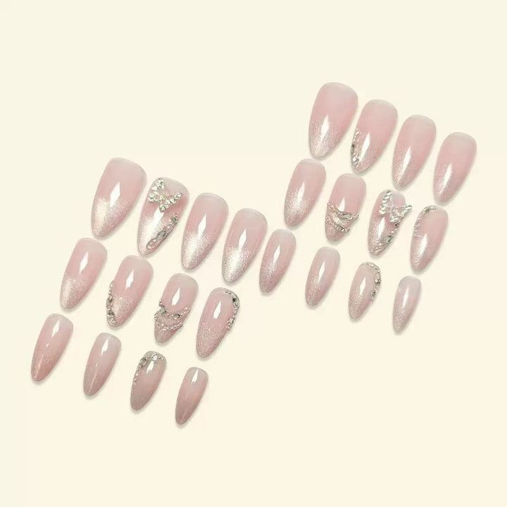 Elegant Stiletto Nail Design with Rhinestone Embellishments Bowlift