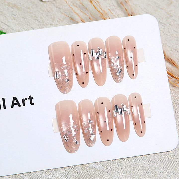 Artificial nail set with sparkling glitter and elegant jewelry details Bowlift