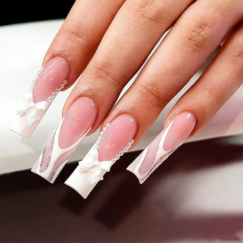 Artificial nail set with elegant bow and pearl decorations Bowlift