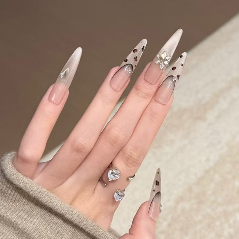 Artistic Stiletto Press-On Nails with Gemstone and Decorative Accents Bowlift