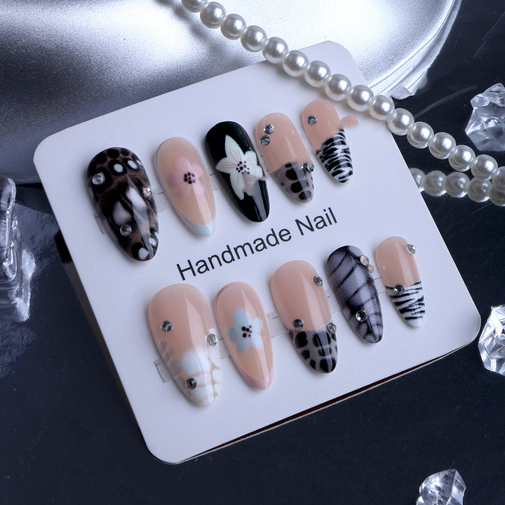Nail art with elegant designs and embellishments Bowlift