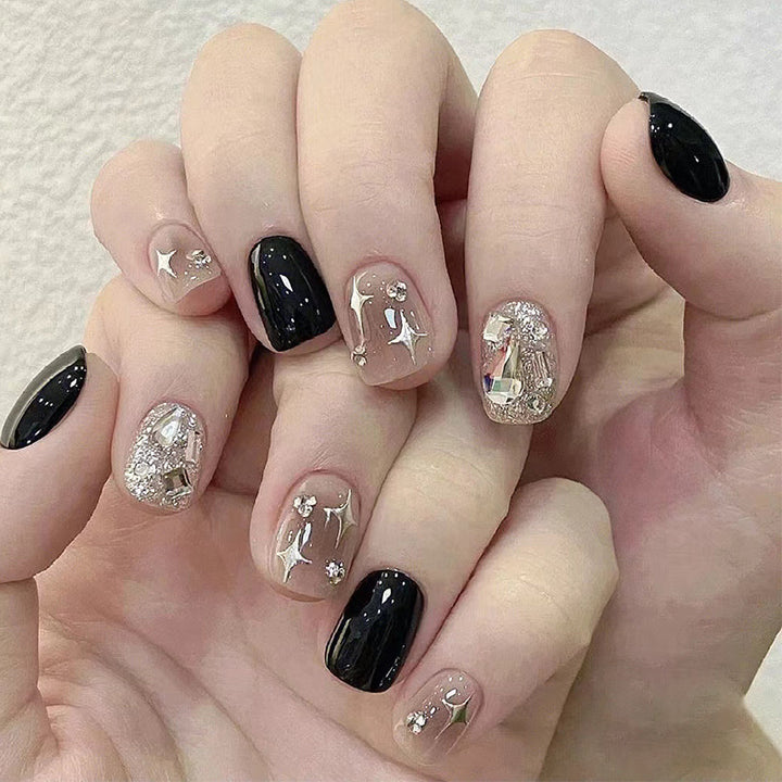 Elegant Nail Art with Glitter and Star Motifs Bowlift