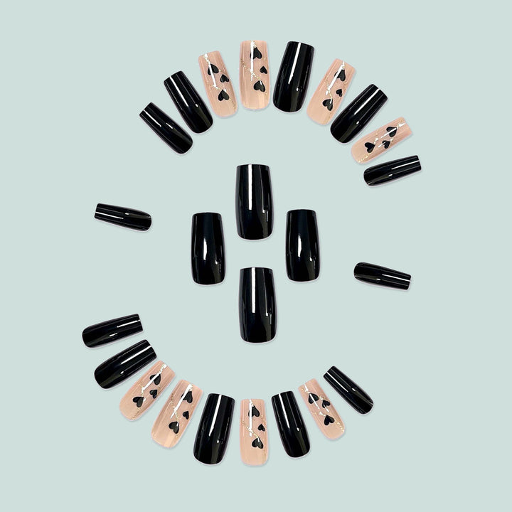 Artistic acrylic nails with heart design and glitter accents Bowlift