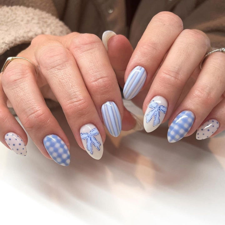 Artful Nail Art with Flower Design and Blue French Tip Bowlift