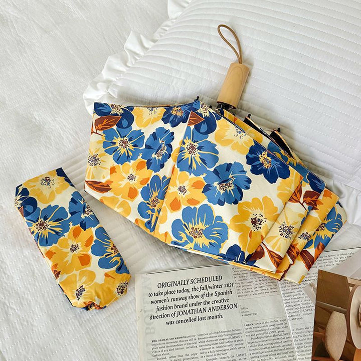 Women Folding Umbrella with Detailed Floral Design Bowlift