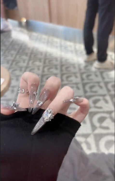 Glamorous artificial nails with rhinestone accents Bowlift