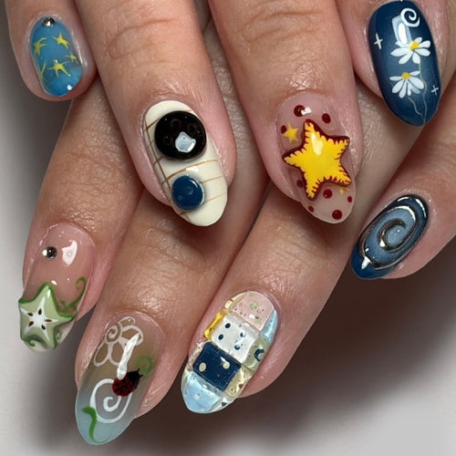 Artificial nails with creative maritime designs and 3D elements Bowlift
